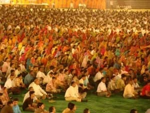 A sea of seekers meditating together